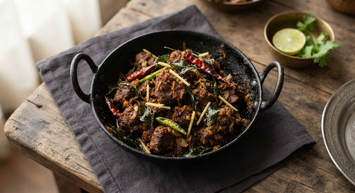 Spiced mutton fry in a black kadai