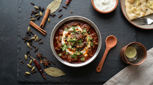 Kashmiri mutton rogan josh in a dark serving bowl