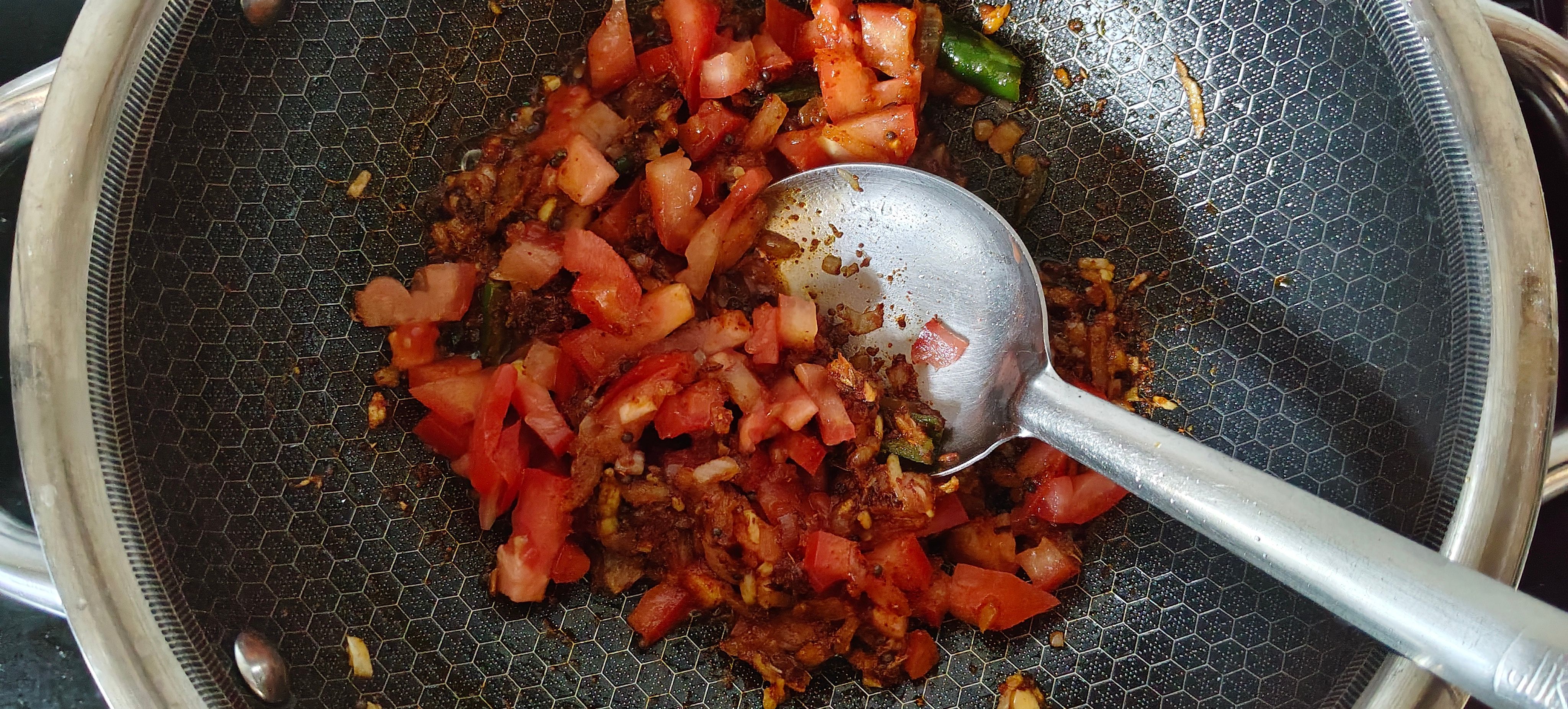 Cook tomatoes and spices