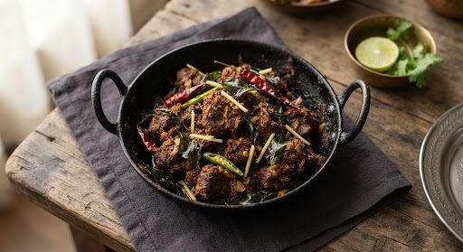 Spiced mutton fry in a black kadai